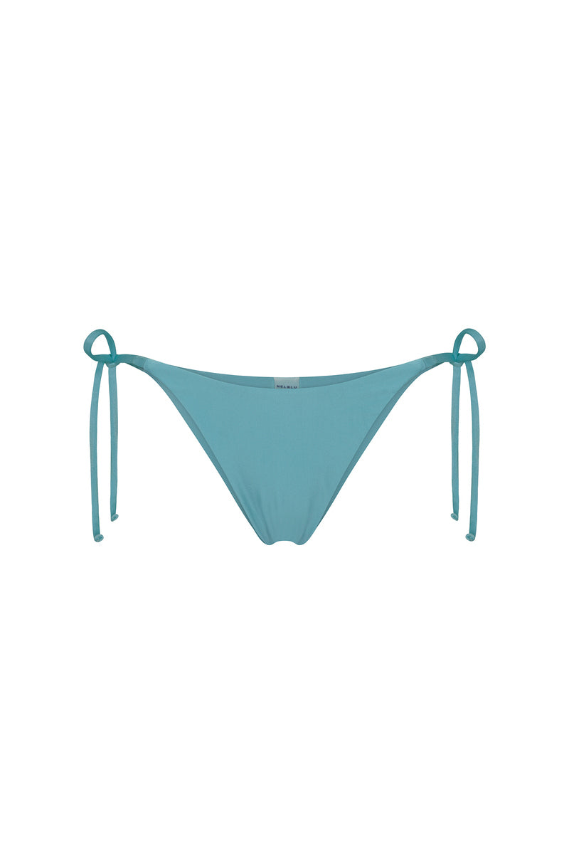 Nelblu SOL bikini bottom in stone blue, featuring a stylish swimwear design with adjustable side ties and smooth fabric.