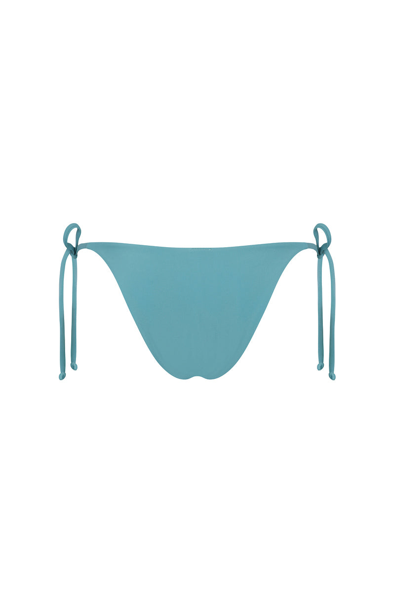 Nelblu SOL bikini bottom in stone blue with a smooth fabric finish, designed for a comfortable and stylish swimwear look.