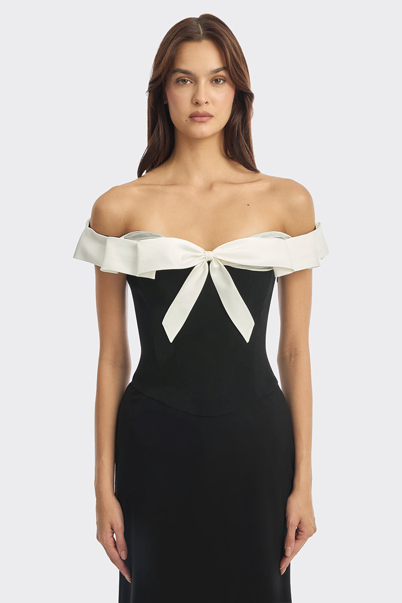 Black bow corset maxi gown by Stolen Stores featuring a fitted bustier style and elegant flowy skirt.