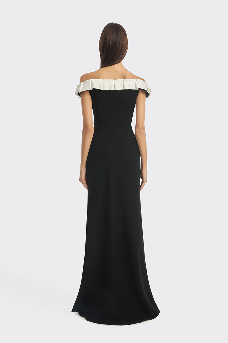 Black bow corset maxi gown by Stolen Stores featuring a fitted bustier style with elegant design and flowing skirt.