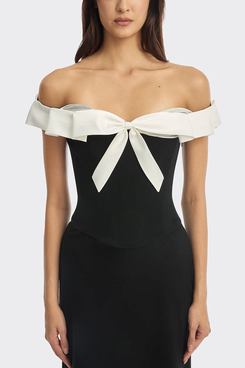 Black bow corset maxi gown by Stolen Stores featuring a fitted bustier style and elegant flowing skirt.