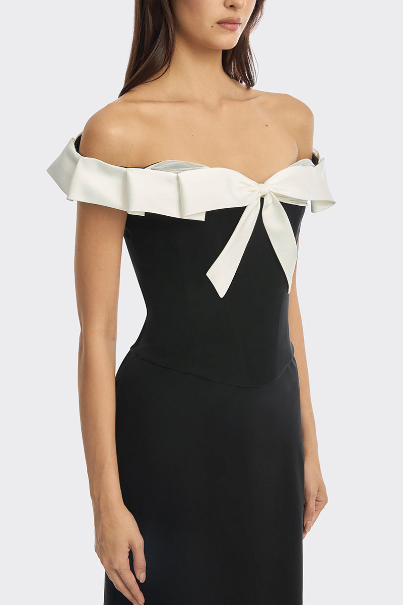 Black bow corset maxi gown by Stolen Stores featuring a structured bustier and elegant flowing skirt.