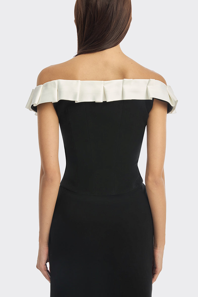 Black bow corset maxi gown by Stolen Stores featuring a fitted bustier style and elegant flowing skirt.
