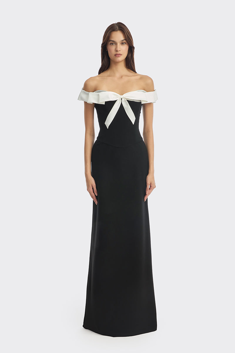 Black bow corset maxi gown from Stolen Stores featuring a structured bustier design and elegant flowing skirt.
