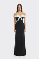 Black bow corset maxi gown from Stolen Stores featuring a structured bustier design and elegant flowing skirt.