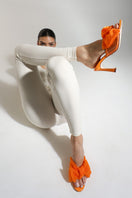 Orange patent bow mule sandals by House of Atana, featuring a stylish bow detail and slip-on design for casual chic footwear.