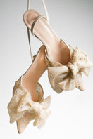 Beige Nappa slip-on heels with a decorative bow from House of Atana, featuring a sleek and elegant design.