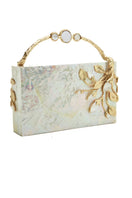 Blue Emm Kuo Brancuse clutch bag with sleek design and textured surface, shown in a close-up image.