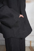 Black Bridge Weave blazer pants by MAZ Manuela Álvarez, featuring tailored fit and stylish fabric weave detail.