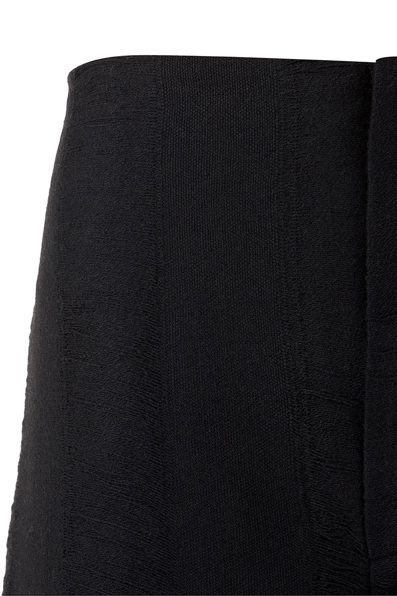 Black Bridge Weave blazer pants by MAZ Manuela Álvarez, tailored fit with detailed woven fabric, front and side view.