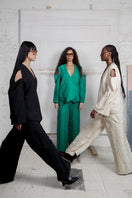 Maz Manuela Álvarez ivory Bridge Weave blazer pants, tailored with a sleek, woven fabric and classic fit, shown on a model.