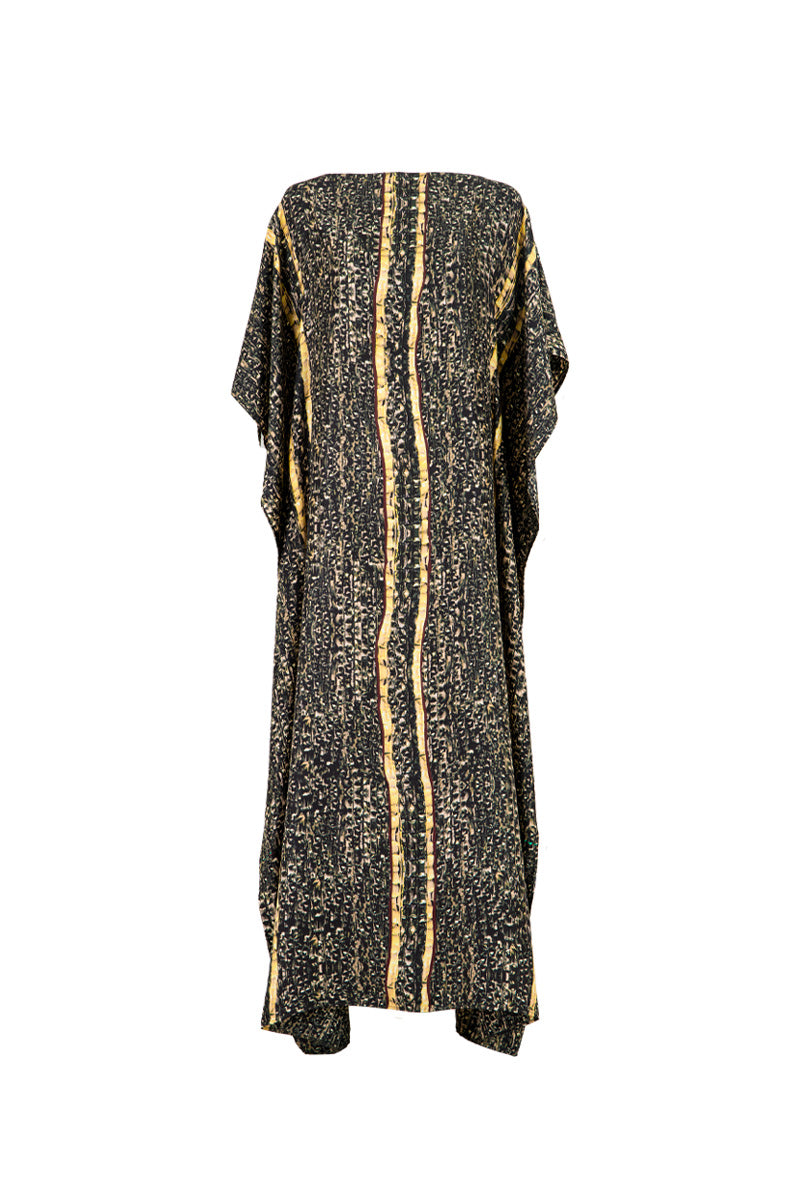 Brown Brocot kaftan maxi dress by Amel Batita with flowing fabric and intricate pattern, displayed on a mannequin.