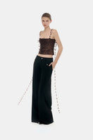 Brown 3D floral strap top by Montsand, featuring textured floral details and slim straps, displayed on a neutral background.