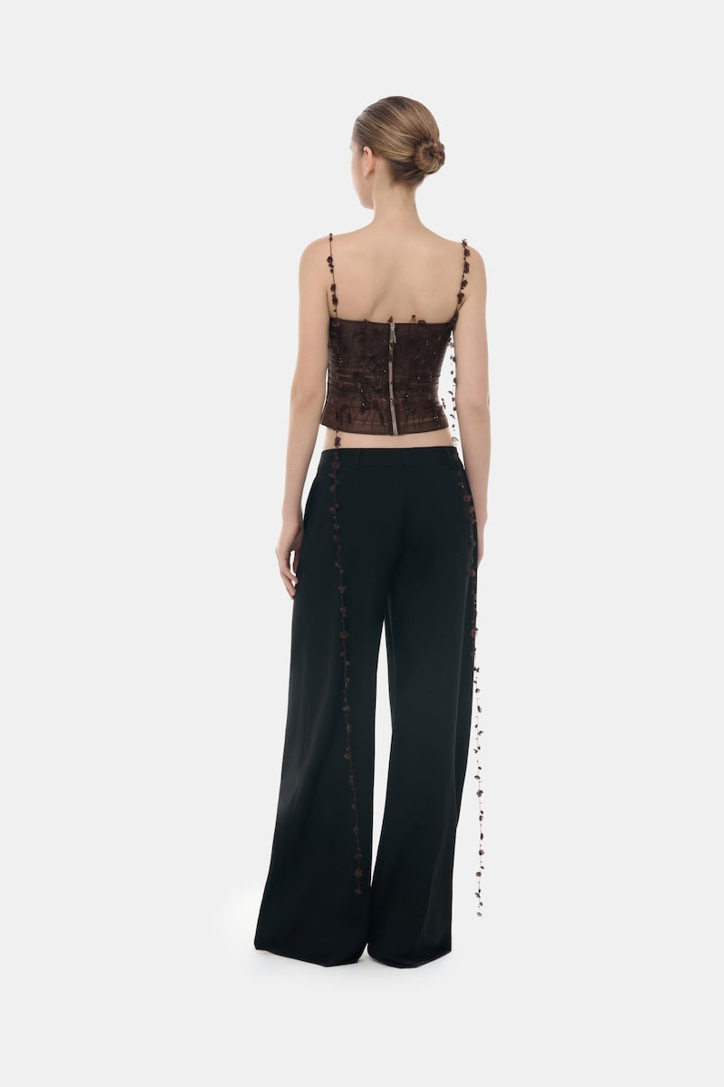 Brown 3D floral strap top by Montsand, featuring textured fabric and adjustable straps, displayed on a mannequin.