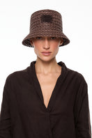 Brown bucket hat by LE SH KA, featuring a wide brim and casual style, shown in a close-up image.