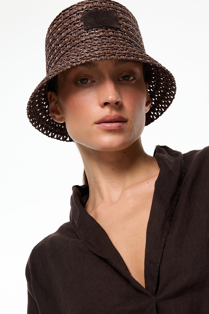Brown LE SH KA bucket hat made of soft fabric, shown from the front with a wide brim and casual style.
