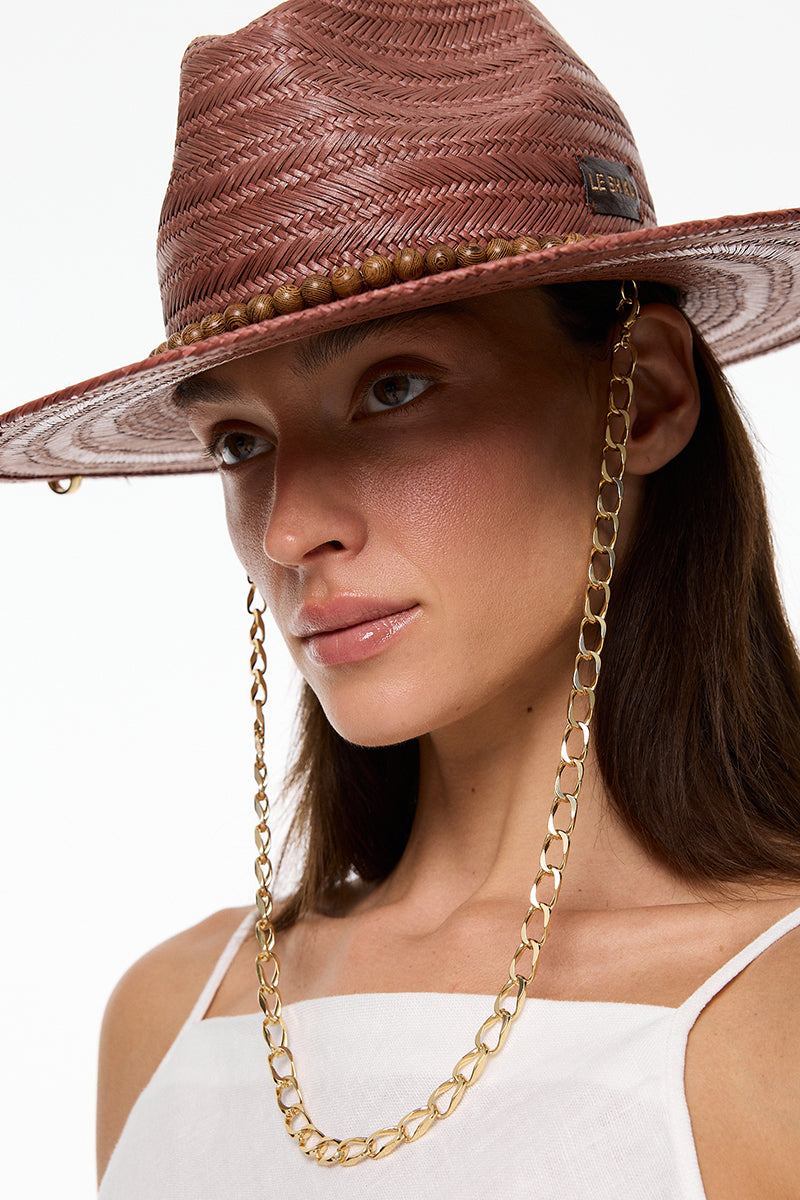 Brown Panama fedora hat by LE SH KA with a wide brim and classic style, shown on a neutral background.