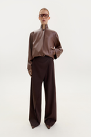 Brown bomber jacket in fox leather by ELENAREVA, featuring a classic design with a smooth leather finish and stylish collar.