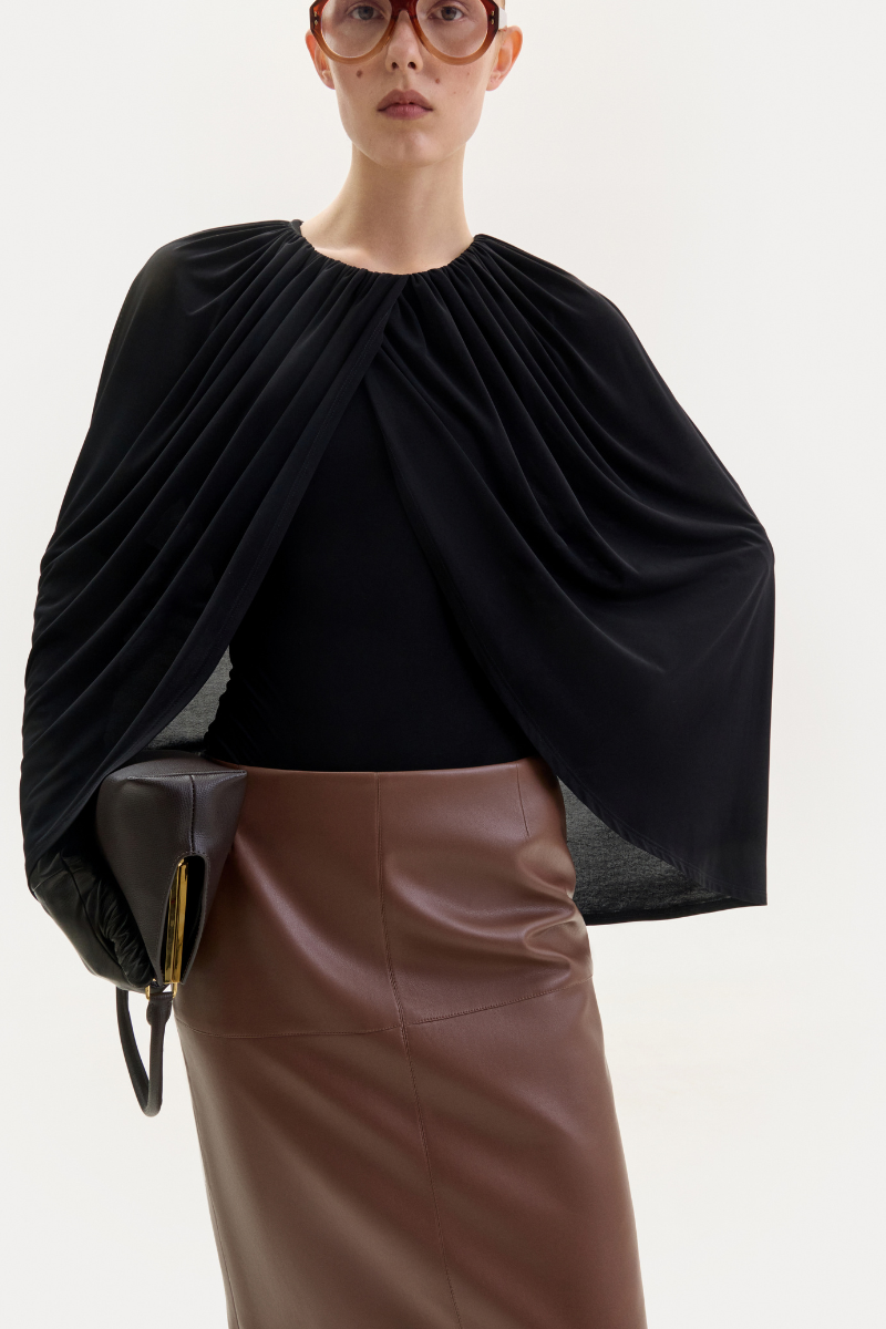 Brown midi skirt in fox leather by ELENAREVA, featuring a sleek design and soft texture, perfect for stylish everyday wear.