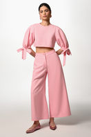 Pink bubble trousers by Liya featuring a loose, puffy fit with elastic waistband and cuffed ankles, suitable for casual wear.