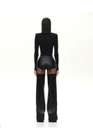 Black Kris Marán buckle bodysuit with cutouts, fitted top featuring stylish buckle details and modern design.