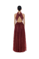 Burgundy smocked lace gown by Montsand, featuring intricate lace detailing and a flowing maxi design for elegant occasions.
