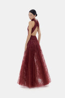 Burgundy smocked lace gown by Montsand featuring a flowing maxi dress design with intricate lace details.