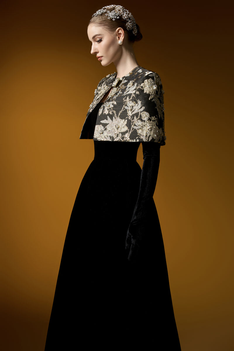 I.H.F Mirabelle Lyon velvet and jacquard gown featuring an A-line silhouette and a mini cape, shown in a stylish formal design.
