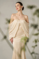 Gold silk taffeta and chiffon mermaid gown with off-shoulder neckline and bishop sleeves by I.H.F.