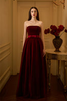 I.H.F LYLA LYON velvet gown featuring a pleated, burstier A-line design, elegant and flowing fabric for formal occasions.