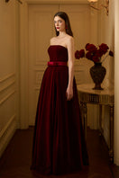 I.H.F LYLA LYON velvet gown featuring a burstier pleated A-line design, elegant and flowing fabric.