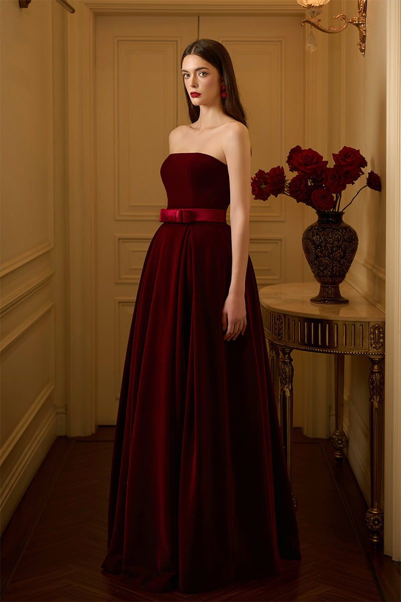 I.H.F LYLA LYON velvet gown featuring a burstier pleated A-line design, elegant and flowing fabric.