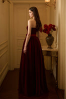 I.H.F LYLA LYON velvet gown featuring a burstier pleated A-line design, elegant and flowing for formal occasions.