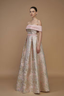 Light pink I.H.F metallic jacquard and silk taffeta gown with a bustier and A-line silhouette, showcased in a stylish fashion photograph.