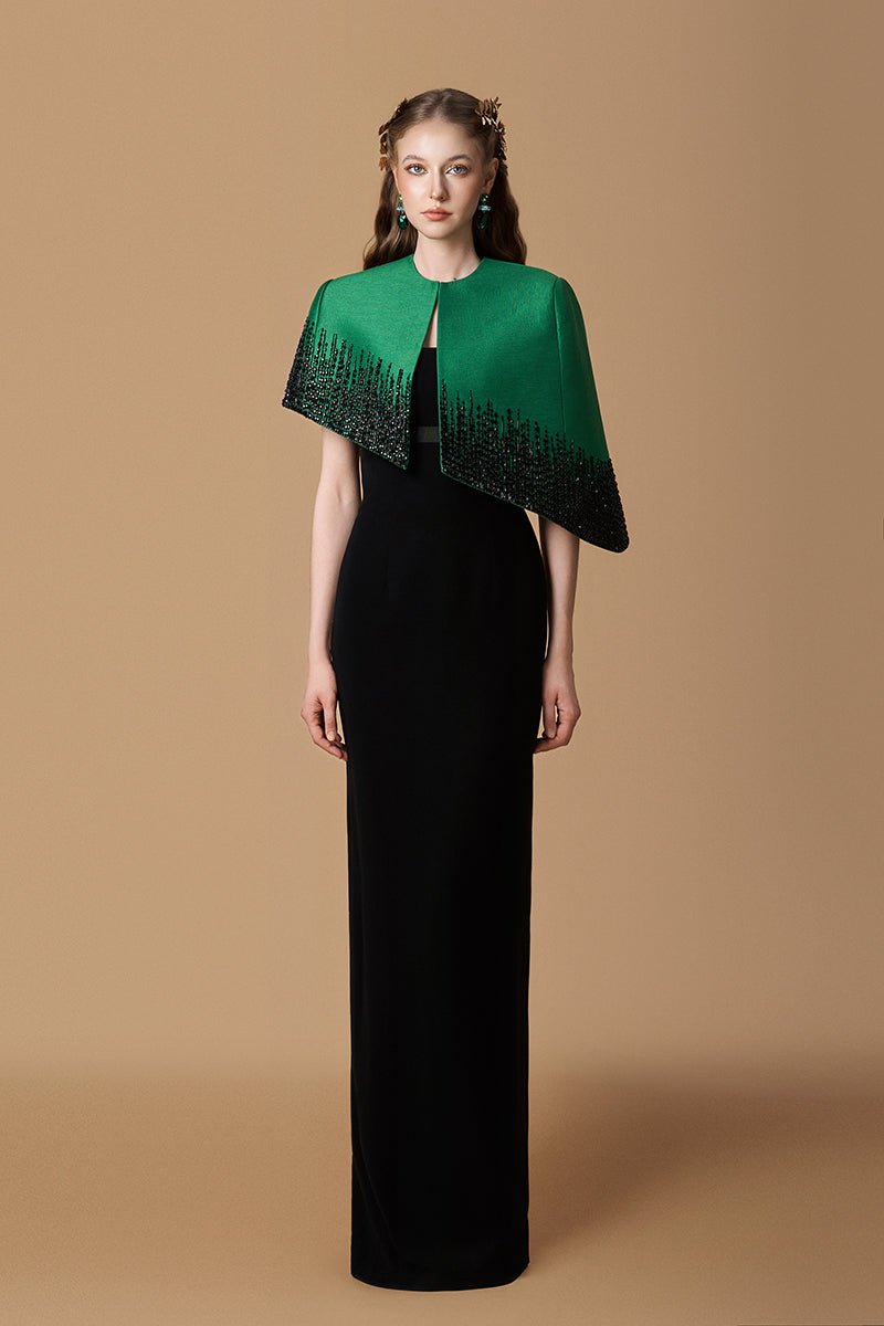 Elegant green and black crepe de chine taffeta gown by I.H.F featuring a bustier, column silhouette, and mini cape detail.