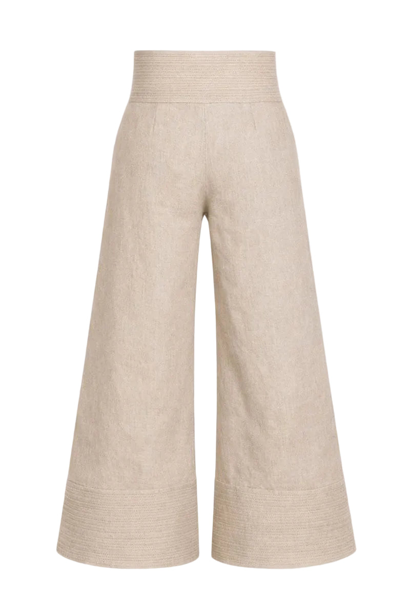 Cream-colored button pants by Ana + Maria featuring front buttons and a relaxed fit, shown in a neutral setting.