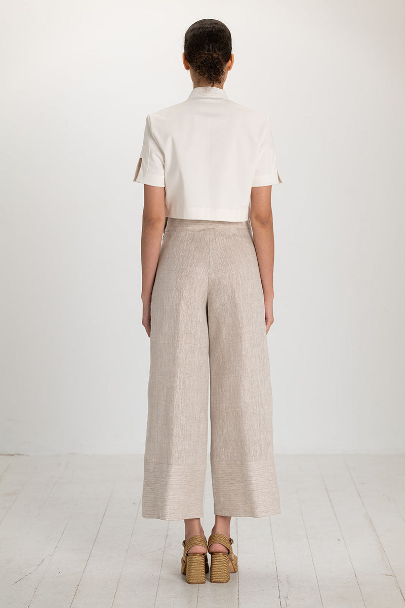 Tan button pants by ANA + MARIA featuring a front button closure and a relaxed fit, shown in size 2.
