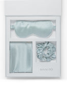 MANITO Sleeping Beauty gift box with soft blue hair accessories, including hair clips and decorative items, in a elegant gift set.