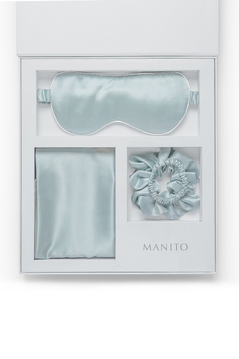 MANITO Sleeping Beauty gift box with soft blue hair accessories, including hair clips and decorative items, in a elegant gift set.