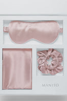 Manito Sleeping Beauty gift box with soft pink hair accessories, including hair clips and scrunchies, arranged inside the box.
