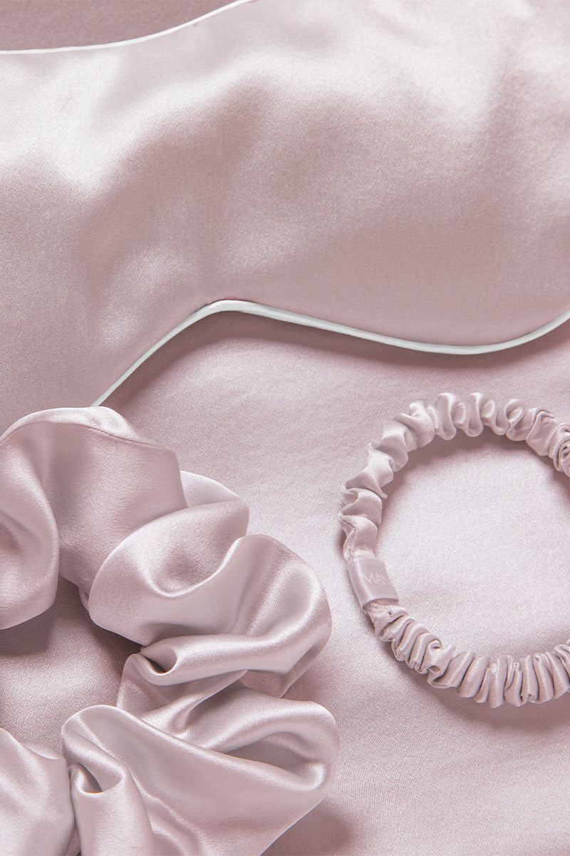 MANITO Sleeping Beauty gift box with soft pink hair accessories, including hair clips and scrunchies, for elegant style.