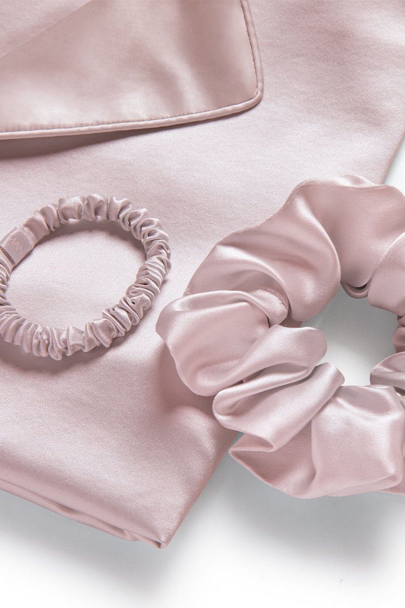 MANITO Sleeping Beauty gift box with soft pink hair accessories, including hair clips and headbands, arranged in a decorative box.