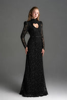 Black lace maxi gown with floral vine pattern, long sleeves, and heart cutout, designed by I.H.F Studio.
