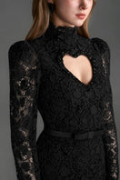 Black lace maxi gown with long sleeves, floral vine design, heart cutout, from I.H.F Studio featuring balloon drawstring detail.