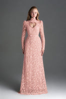 Light pink floral lace gown by I.H.F Studio featuring long sleeves, a heart cutout, and a flowing maxi dress design.