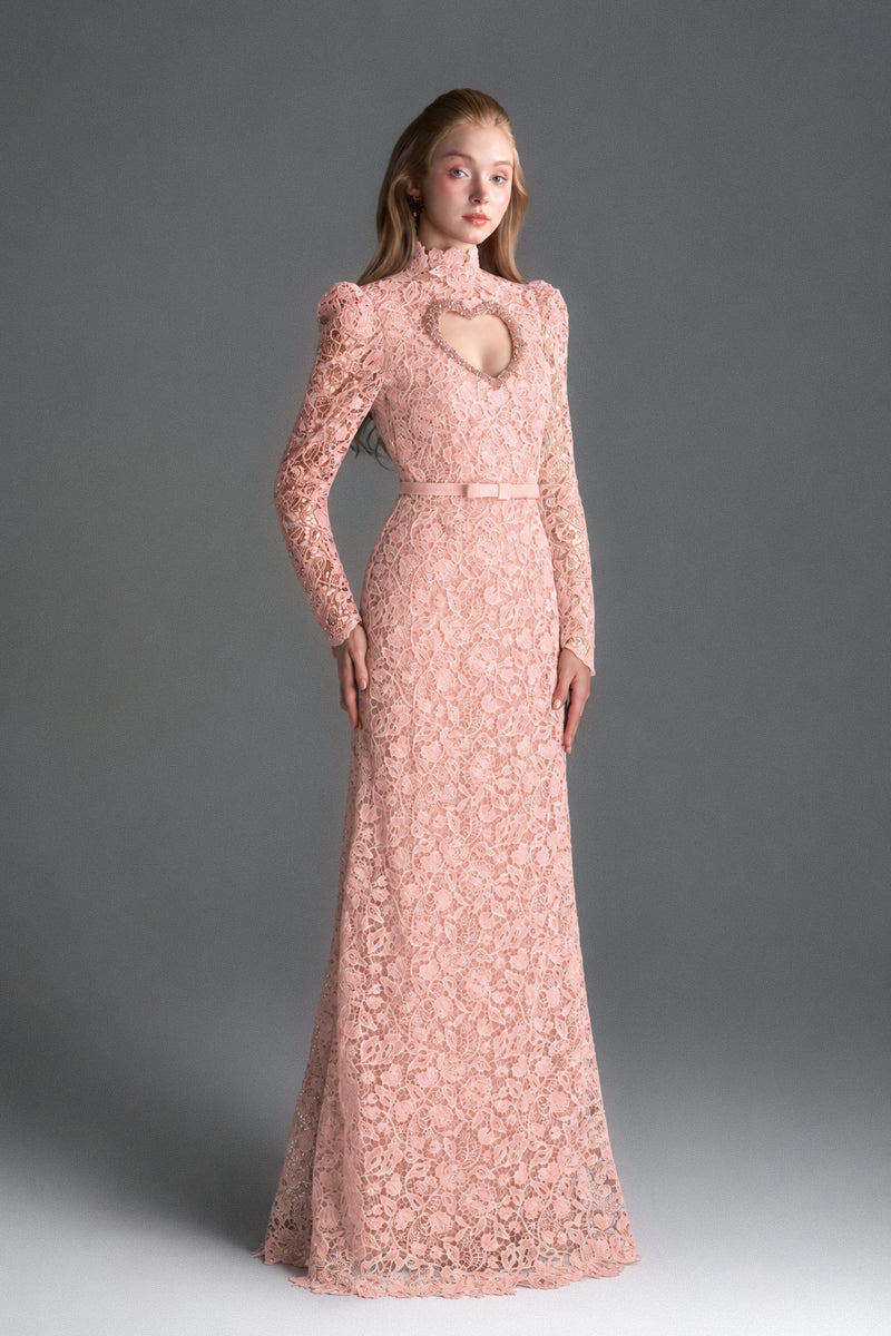 Light pink floral lace maxi gown by I.H.F Studio featuring long sleeves and a heart cutout, with balloon drawstring detail.