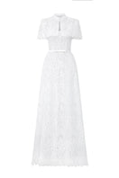 White architectural lace bustier A-line gown by I.H.F Studio with mini cape and crystal embellishments, perfect for elegant occasions.