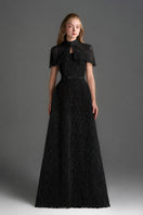 Black architectural lace bustier A-line gown with mini cape and crystal embellishments, by I.H.F Studio.