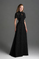 Black architectural lace bustier A-line gown with mini cape and crystal embellishments, designed by I.H.F Studio.
