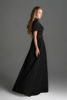 Black architectural lace bustier A-line gown with mini cape and crystal embellishments by I.H.F Studio.